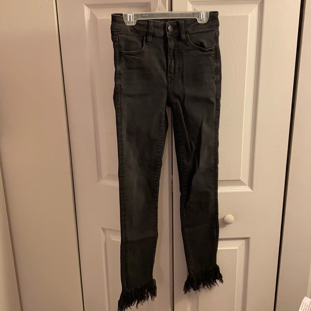 American Eagle black jeans with freyed bottoms